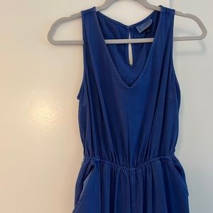 Blue jumpsuit with back cutout and pockets